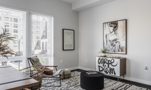 living room with open areas, bright lighting and on wood-style flooring