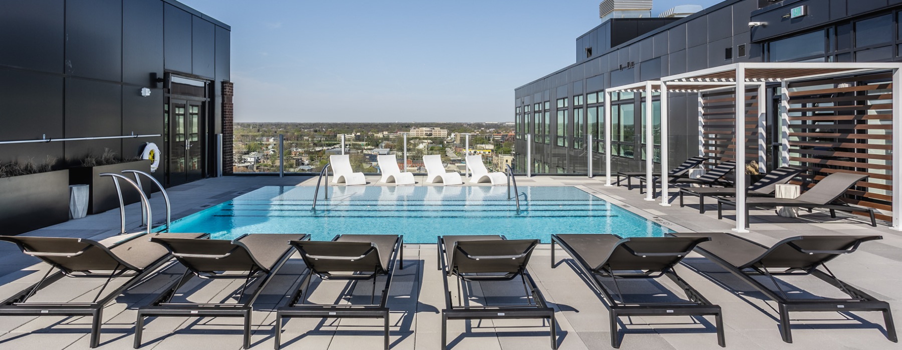 Resort-style swimming pool with lounge seating