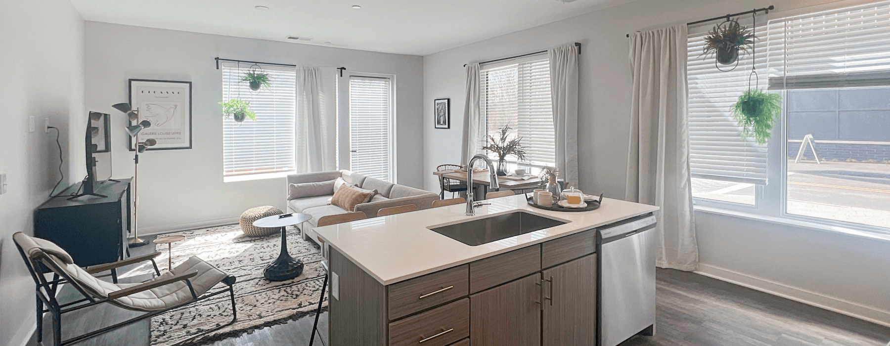 living and kitchen area with natural lighting and ample space for furniture arrangements